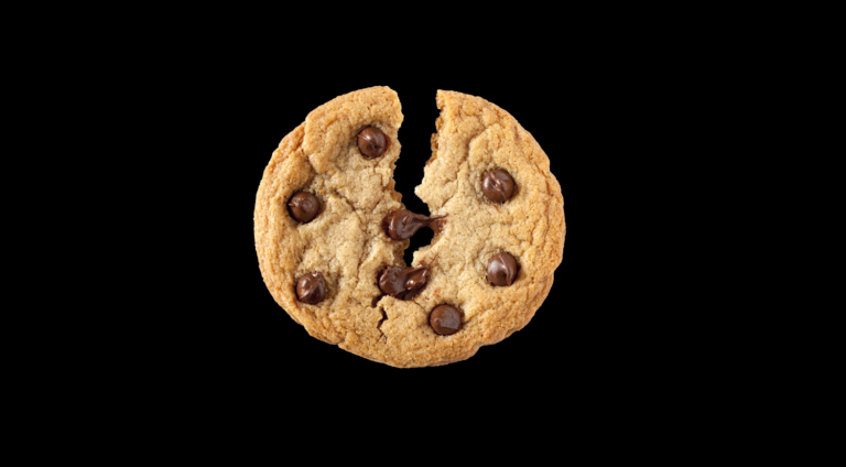 Image of a cookie that is breaking in half.